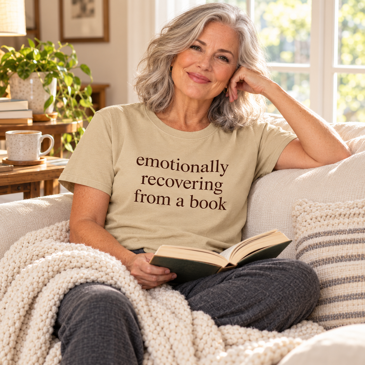 Sand tshirt. Size S-3XL, Woman relaxing on a couch with her favorite book wearing Emotionally recovering from a Book tshirt